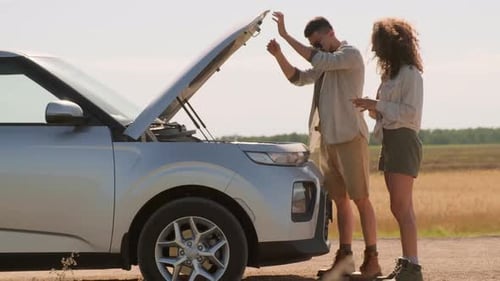 Couple Has Car Trouble on Rural Road Trip