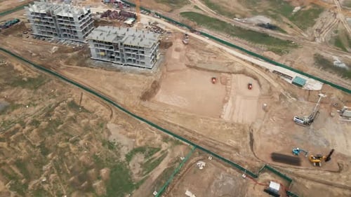 Flight Over The Construction Site. Construction Of Multi Storey Buildings.