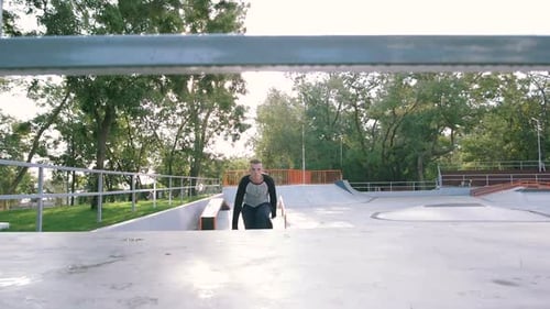 Young Man Doing Parkour Tricks in Extreme Sports Park