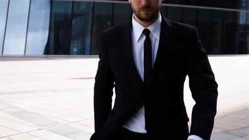Epic Portrait of Successful Serious Businessman Near Business Centre