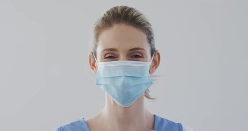 Young Adult Woman Wearing Surgical Mask Close Up