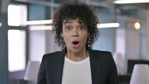 Woman Expresses Shock in Office Environment