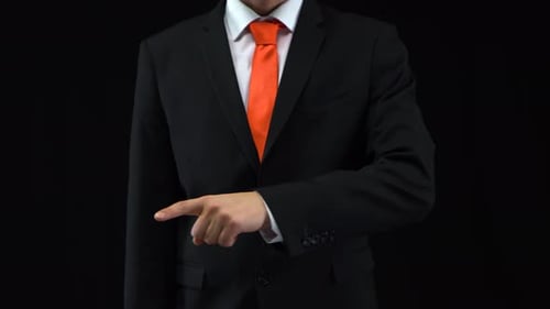 Man Pointing in a Black Suit