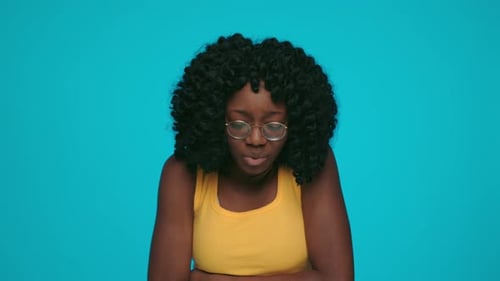 Woman with Stomach Pain on Blue Background