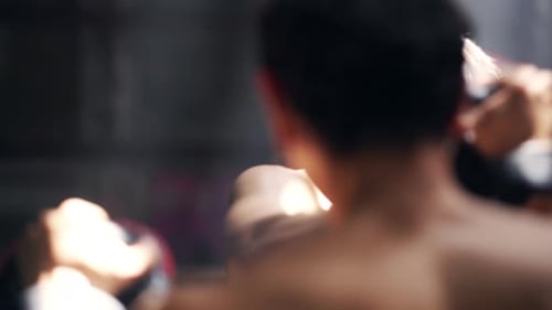 4K Asian man boxer do practicing boxing with male coach in abandoned building.