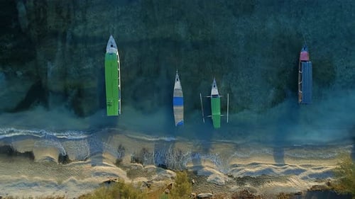 Static Bird's Eye View of a Picturesque Beach and Coast With Moored Fishing Boat