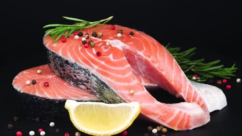Fresh Raw Salmon Steaks with Lemon and Rosemary