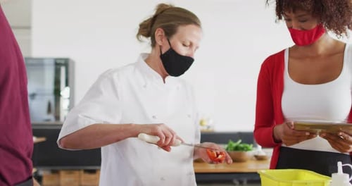 Chef Cuts Vegetables in Kitchen During Coronavirus Pandemic