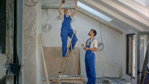 Construction workers renovating apartment house