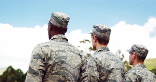 Three Soldiers Standing on Hill Looking at View