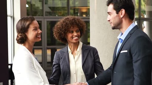 Business People Shaking Hands Indoors
