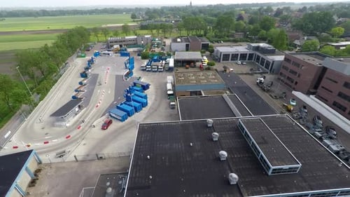 Drone flying over recycling plant.