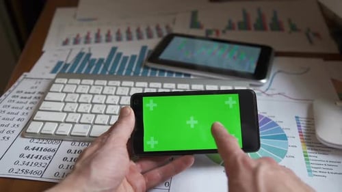 Man Using a Phone With Green Screen