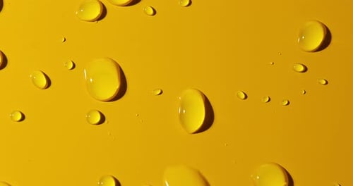Abstract water drops on yellow background, macro, Bubbles close up