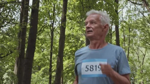 Old Man Jogging in Park