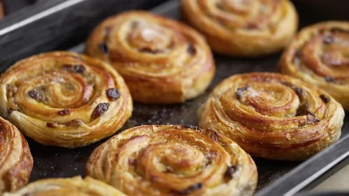 Delicious Fresh Baked Pastry Swirls on Baking Tray