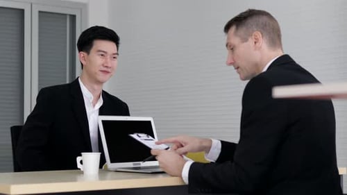 Men Meeting in Corporate Office