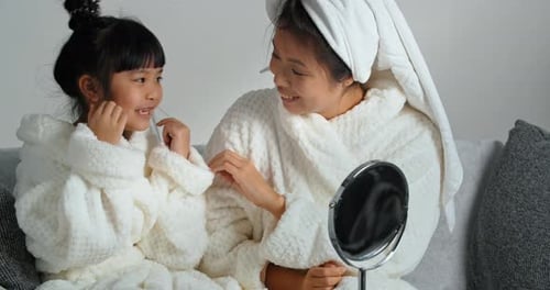 Mother and Daughter Enjoying Beauty Routine at Home