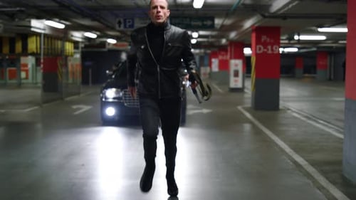 Man Runs From Police Car in Parking Garage