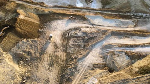 Aerial View of Open Pit Mining Site of Limestone Materials for Construction Industry with Excavators