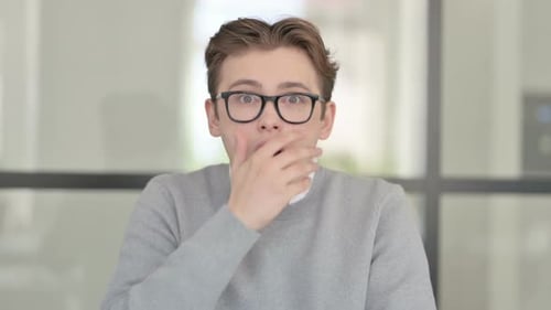 Man Reacts with Shock, Surprise Expression