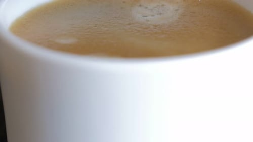 Coffee being brewed into a mug close-up