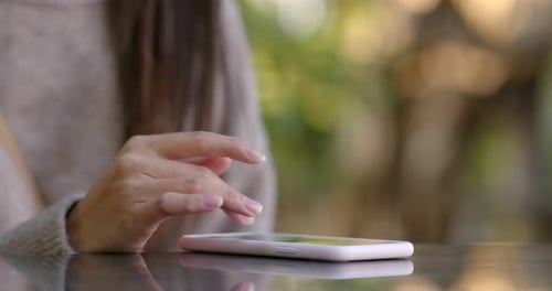 Close up of woman use of mobile phone at outdoor