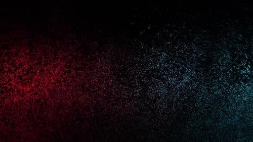 Grünes und rotes Wasserspray gemischt auf schwarzem Hintergrund. Zeitlupe