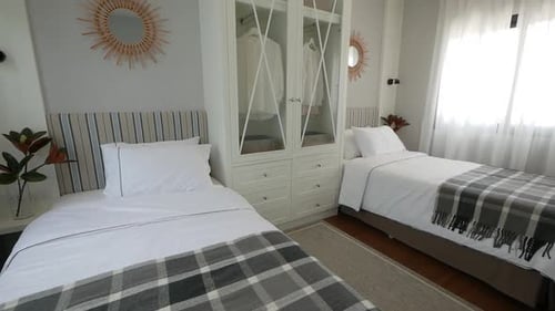 Clean Bedroom With Two Twin Beds