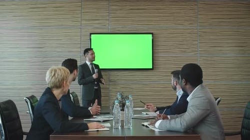 Businessman Presenting Something at Meeting