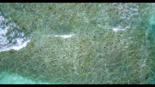Aerial top down seascape of exotic seashore beach holiday by turquoise ocean and white sandy backgro