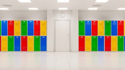 Bright hallway with colourful lockers at school. Close up on a classroom's door.