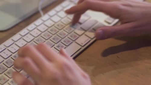 Man Typing Messages in Chat and Social Networks or Writing Codes By the White Keyboard. Close Up