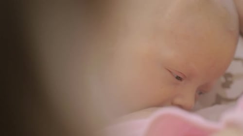 Newborn Infant Yawns and Falls Asleep