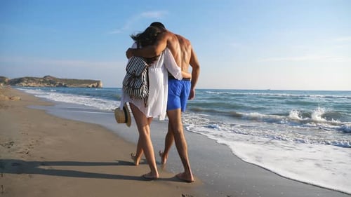 Couple of Lovers Walking at Coast and Hugging During Resting on Resort. Man and Woman Strolling on