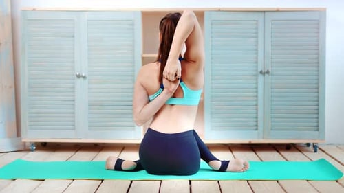 Attractive Slender Woman Wearing Sports Suit Making Stretching Folded Her Hands in Lock Behind Back