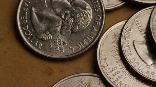 Rotating stock footage shot of American quarters (coin - $0.25) - MONEY 0228