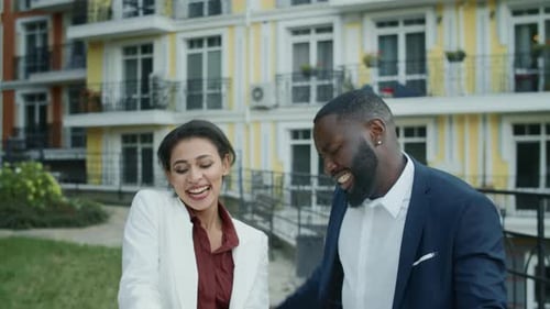 Two Adults Celebrate Good News with Dancing