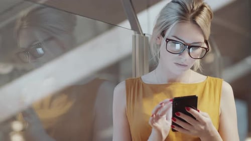 Stylish Woman Using Smart Phone in Modern City