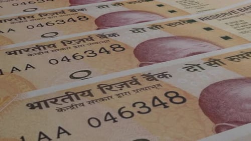 Indian Rupee bills background.