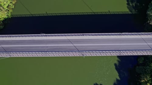 Car Driving Over Bridge