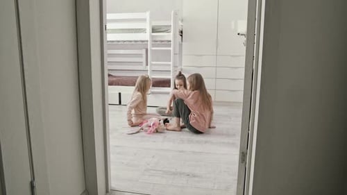 Three Girls Playing Together in Bedroom