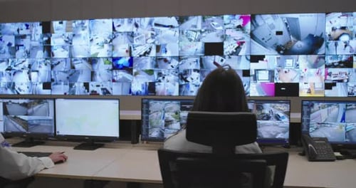 Control Room Monitors Security Feeds in Modern Office