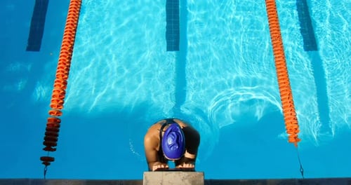 High angle view of female swimmer swimming inside pool 4k