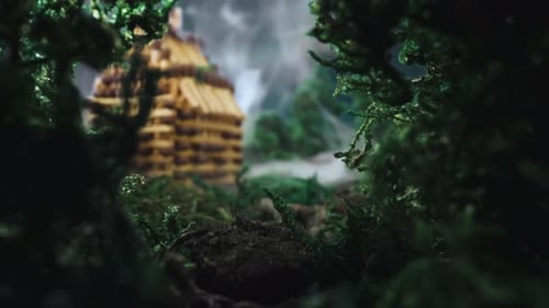 Miniature Scene with Small Building in Smoke in Spring Wood