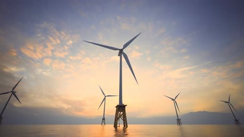 Offshore Wind Turbines Generating Clean Energy at Sunset