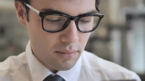 Businessman Scrolling Smartphone