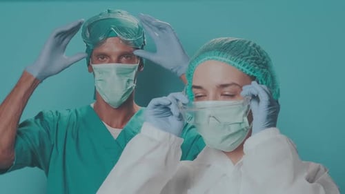 Medical Professionals Wearing Protective Gear in Hospital Setting