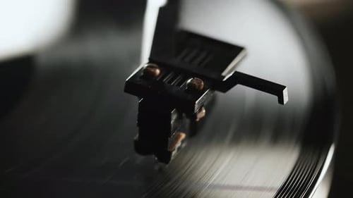Record Player Needle on Spinning Vinyl Record Close Up