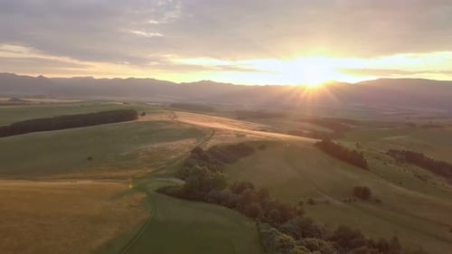 Aerial View of Rolling Hills at Sunrise